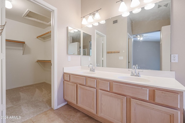 bathroom featuring tile patterned floors, vanity, and ceiling fan