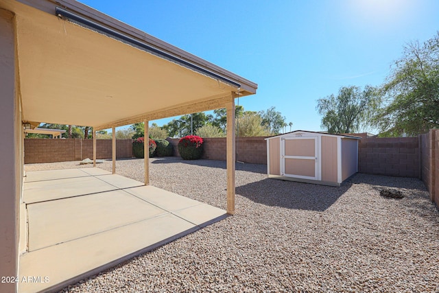 view of patio with a shed