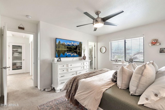 carpeted bedroom featuring ceiling fan