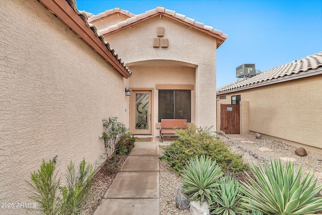 doorway to property featuring central AC unit