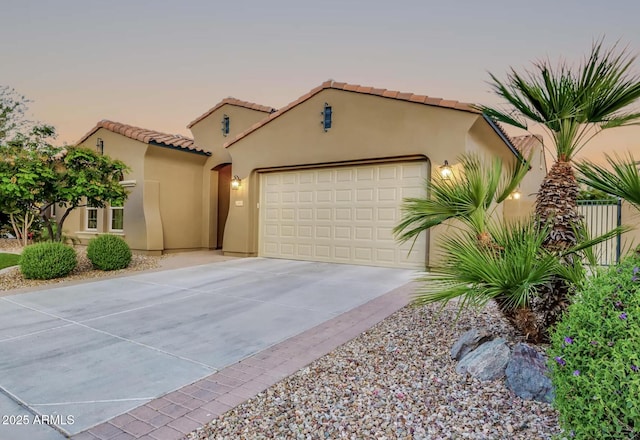 mediterranean / spanish-style house featuring a garage