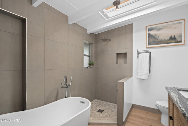 5809 N 10th Pl, Phoenix, AZ 85014 - full bathroom featuring walk in shower, a freestanding bath, toilet, vanity, and wood finished floors