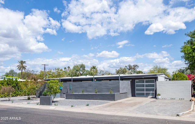 5809 N 10th Pl, Phoenix, AZ 85014 - exterior space with concrete driveway, a garage, and fence