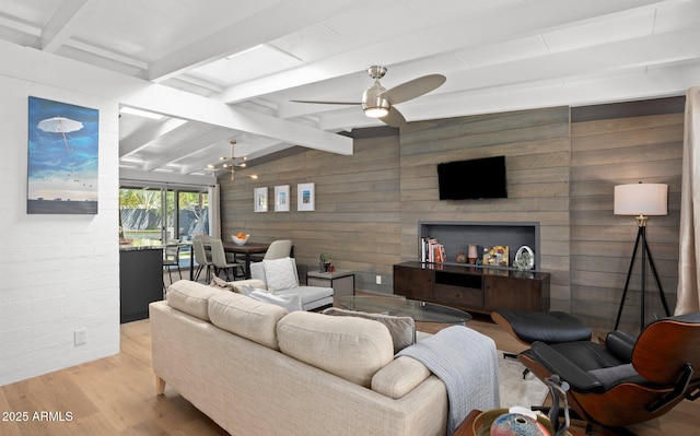 5809 N 10th Pl, Phoenix, AZ 85014 - living area with lofted ceiling with beams, wood finished floors, wooden walls, and ceiling fan