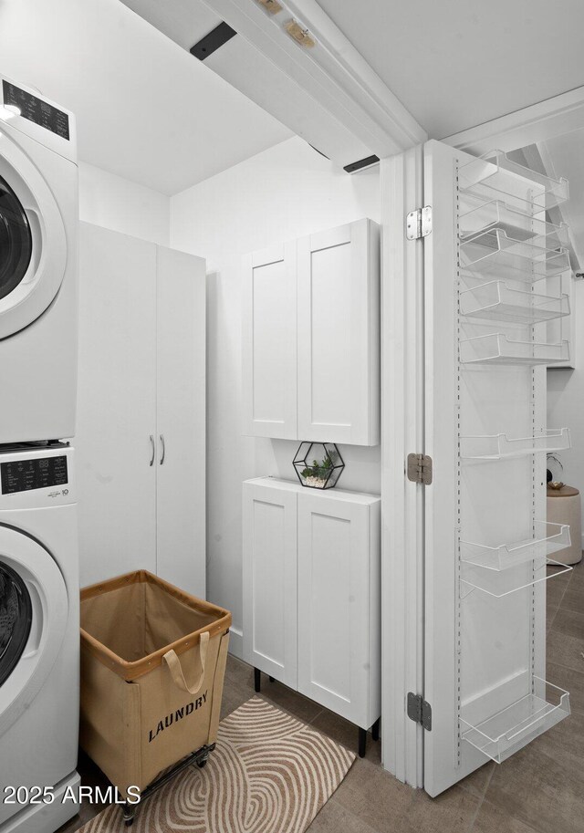 5809 N 10th Pl, Phoenix, AZ 85014 - clothes washing area with stacked washing maching and dryer and laundry area