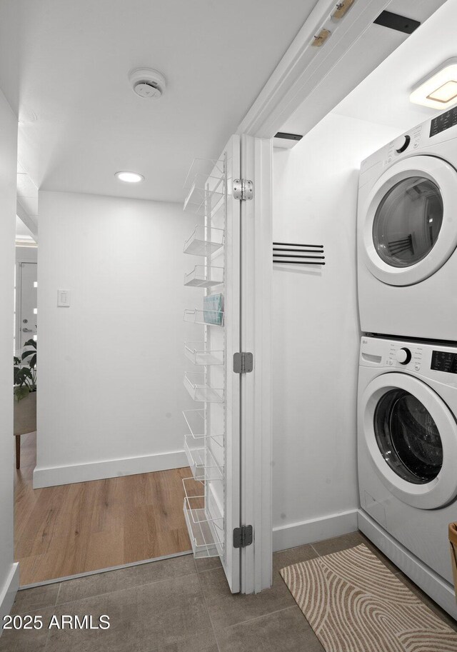 5809 N 10th Pl, Phoenix, AZ 85014 - laundry area with recessed lighting, stacked washer / dryer, baseboards, and laundry area
