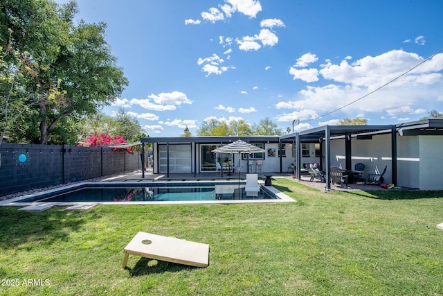 5809 N 10th Pl, Phoenix, AZ 85014 - back of property featuring a fenced backyard, a fenced in pool, a patio, and a lawn