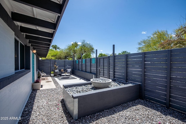 5809 N 10th Pl, Phoenix, AZ 85014 - view of patio / terrace with a fire pit and a fenced backyard