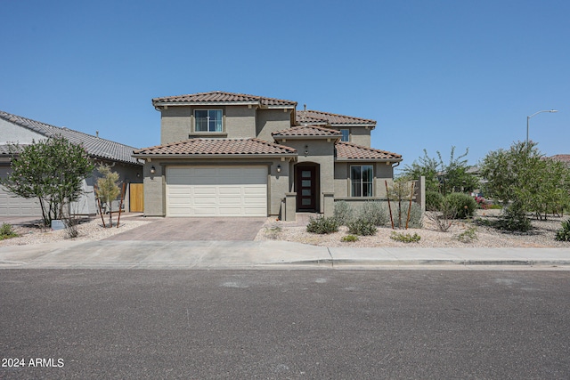 mediterranean / spanish-style house featuring a garage