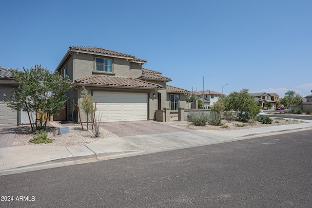 mediterranean / spanish-style house featuring a garage