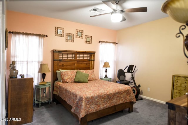 bedroom featuring ceiling fan and dark colored carpet