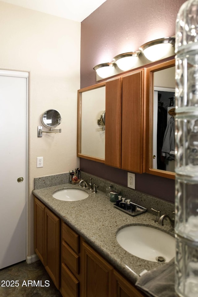 bathroom featuring tile patterned flooring and vanity