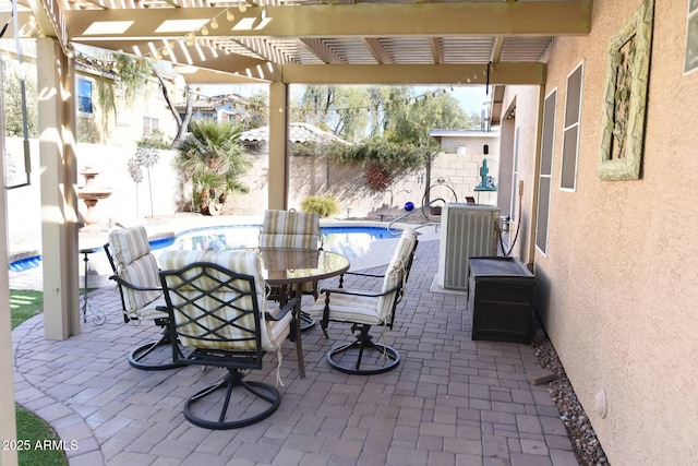 view of patio / terrace with cooling unit, a fenced in pool, and a pergola