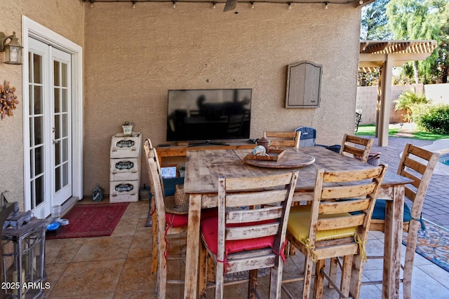 view of patio / terrace featuring a pergola, an outdoor bar, and french doors