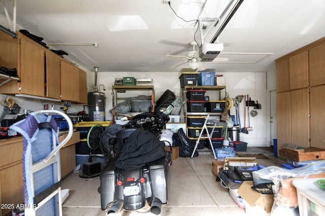 garage with a garage door opener, gas water heater, and ceiling fan