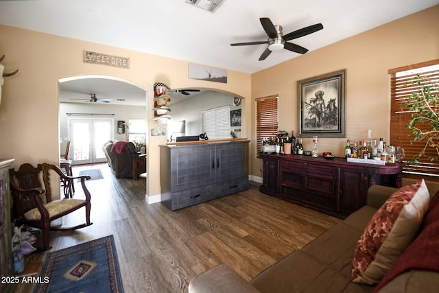 living room with hardwood / wood-style flooring and ceiling fan