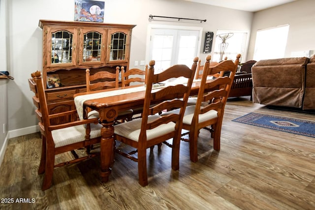 dining area with wood-type flooring