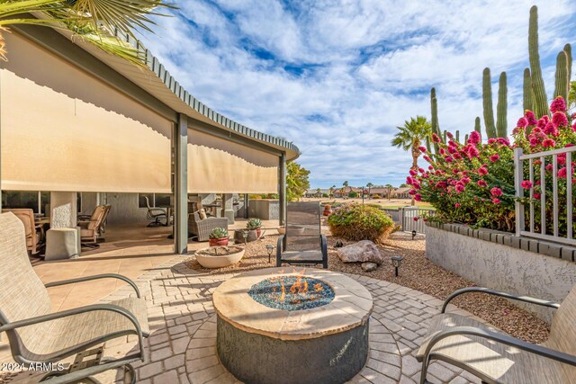 view of patio / terrace with a fire pit