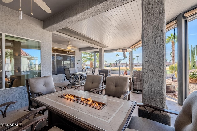 view of patio / terrace featuring a fire pit and ceiling fan