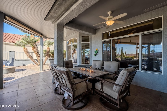 view of patio featuring a fire pit and ceiling fan