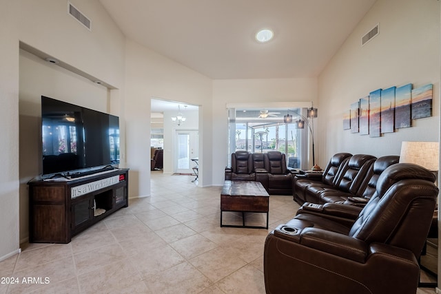 tiled living room featuring vaulted ceiling and an inviting chandelier