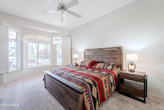 bedroom with ceiling fan and light carpet