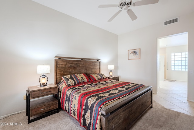 bedroom with light tile patterned floors and ceiling fan