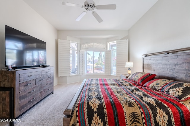 bedroom with ceiling fan and light colored carpet