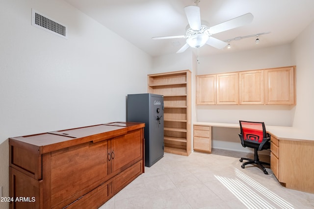 office space featuring ceiling fan, built in desk, and track lighting