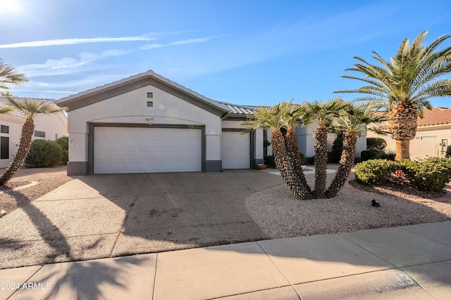 single story home with a garage