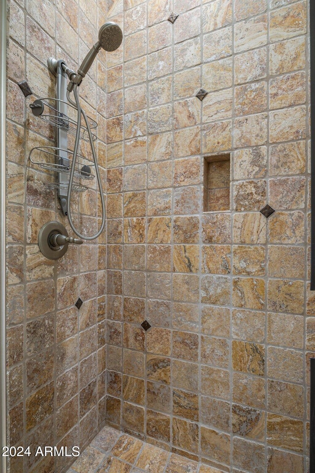 bathroom with tiled shower