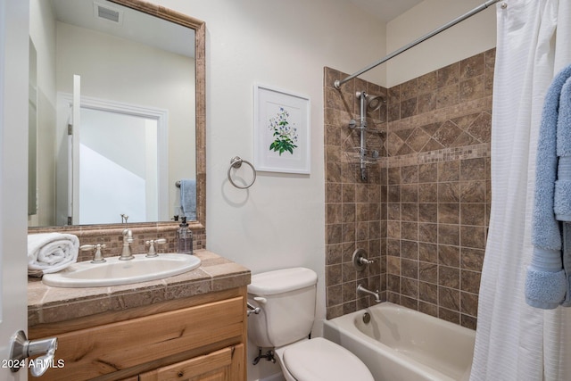 full bathroom featuring vanity, toilet, and shower / bathtub combination with curtain