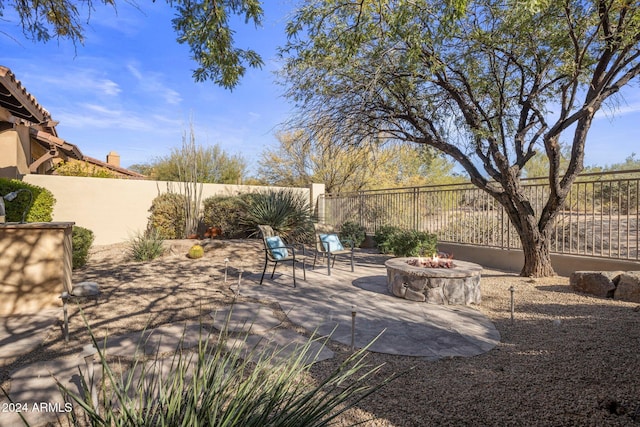 view of patio / terrace featuring a fire pit