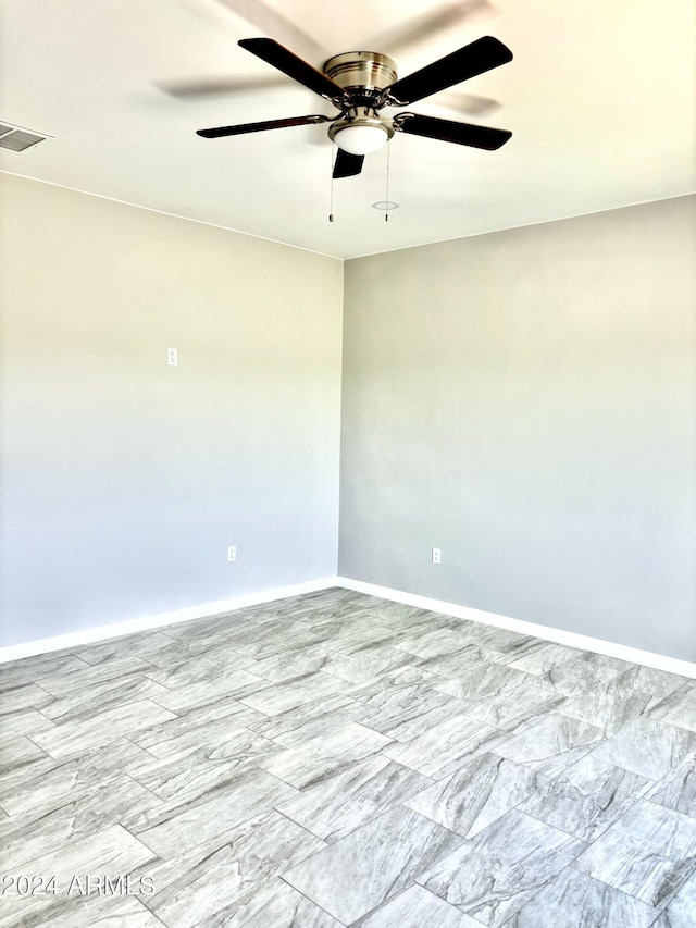 spare room featuring ceiling fan