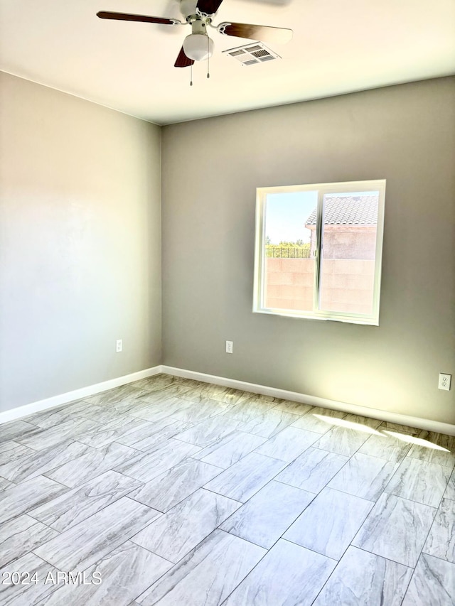 spare room featuring ceiling fan