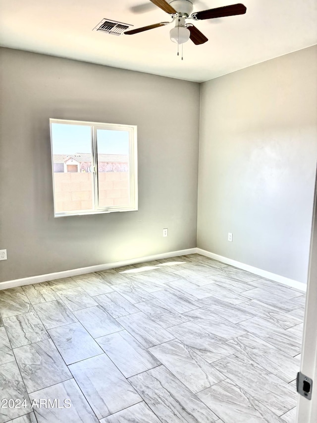 unfurnished room with ceiling fan