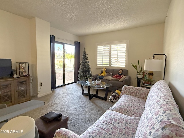 living room featuring a textured ceiling and light colored carpet