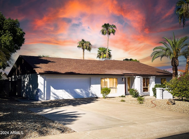 single story home with a garage