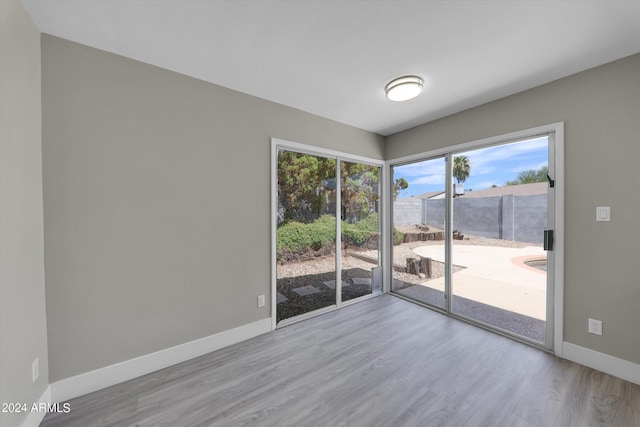 spare room with light wood-type flooring