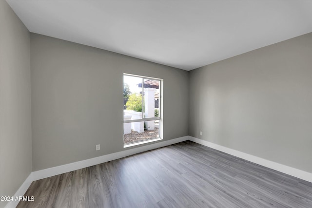 spare room with hardwood / wood-style flooring