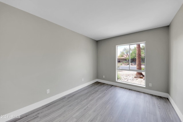 empty room with light hardwood / wood-style floors