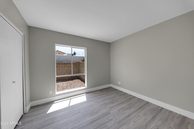 spare room featuring light hardwood / wood-style flooring