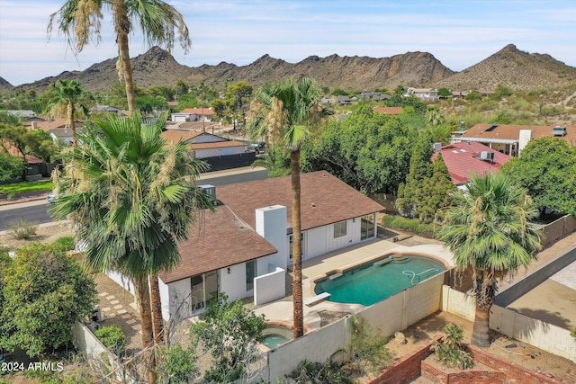 birds eye view of property with a mountain view