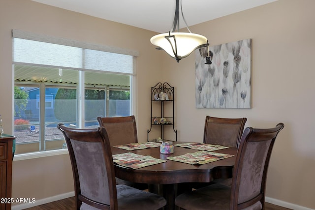 dining room featuring baseboards