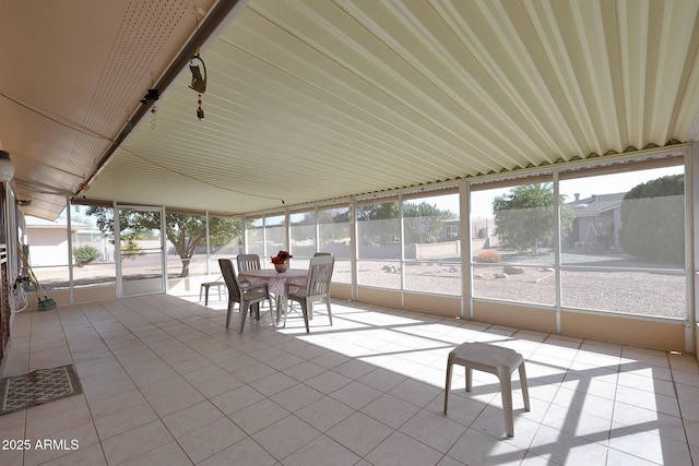 unfurnished sunroom with a wealth of natural light