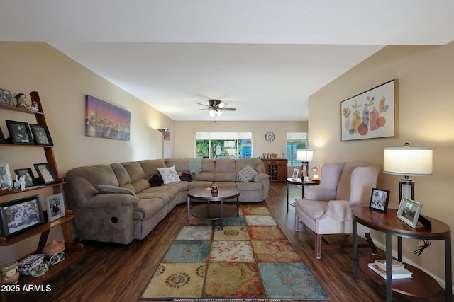 living area with wood finished floors and a ceiling fan