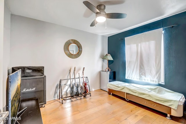 bedroom with wood-type flooring and ceiling fan