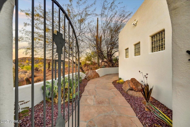 view of patio terrace at dusk