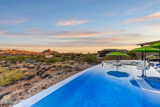 view of swimming pool featuring a patio area