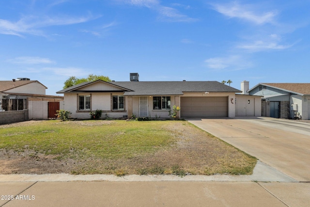 ranch-style house with a garage and concrete driveway